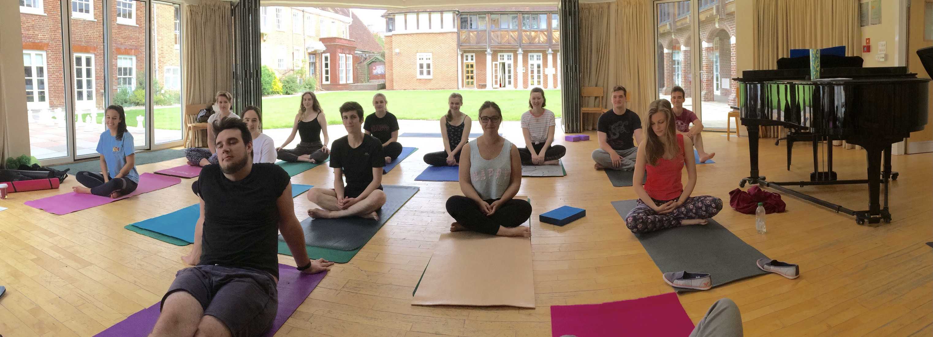 Jules teaching a yoga for singers workshop for Raw Voices in Winchester